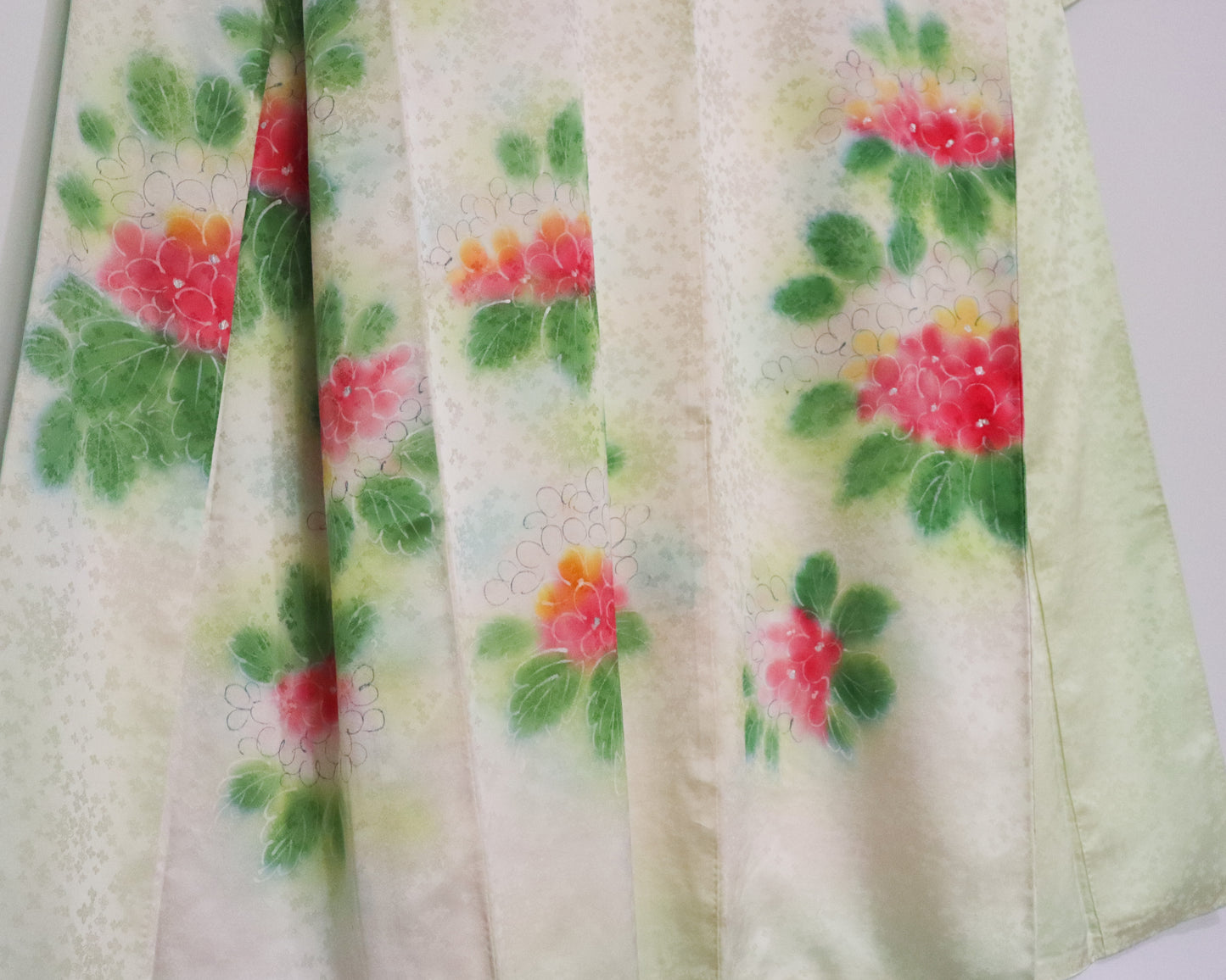 Vintage silk kimono in light pastel green with cute floral pattern.
