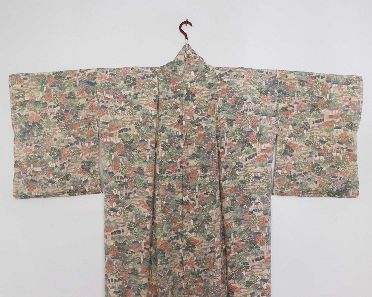vintage silk kimono with unique pattern of people, buildings and nature. Front of kimono.