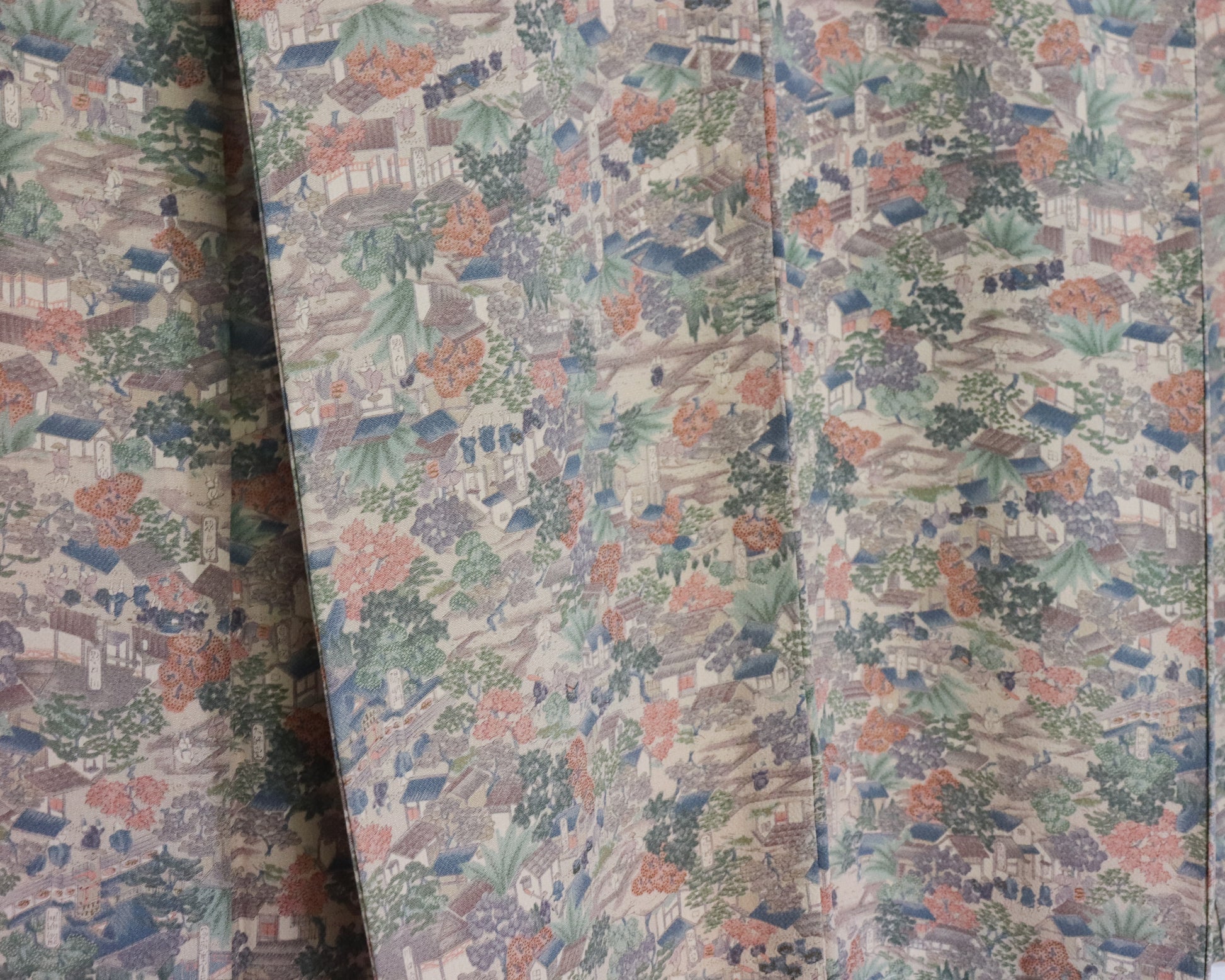 vintage silk kimono with unique pattern of people, buildings and nature.
