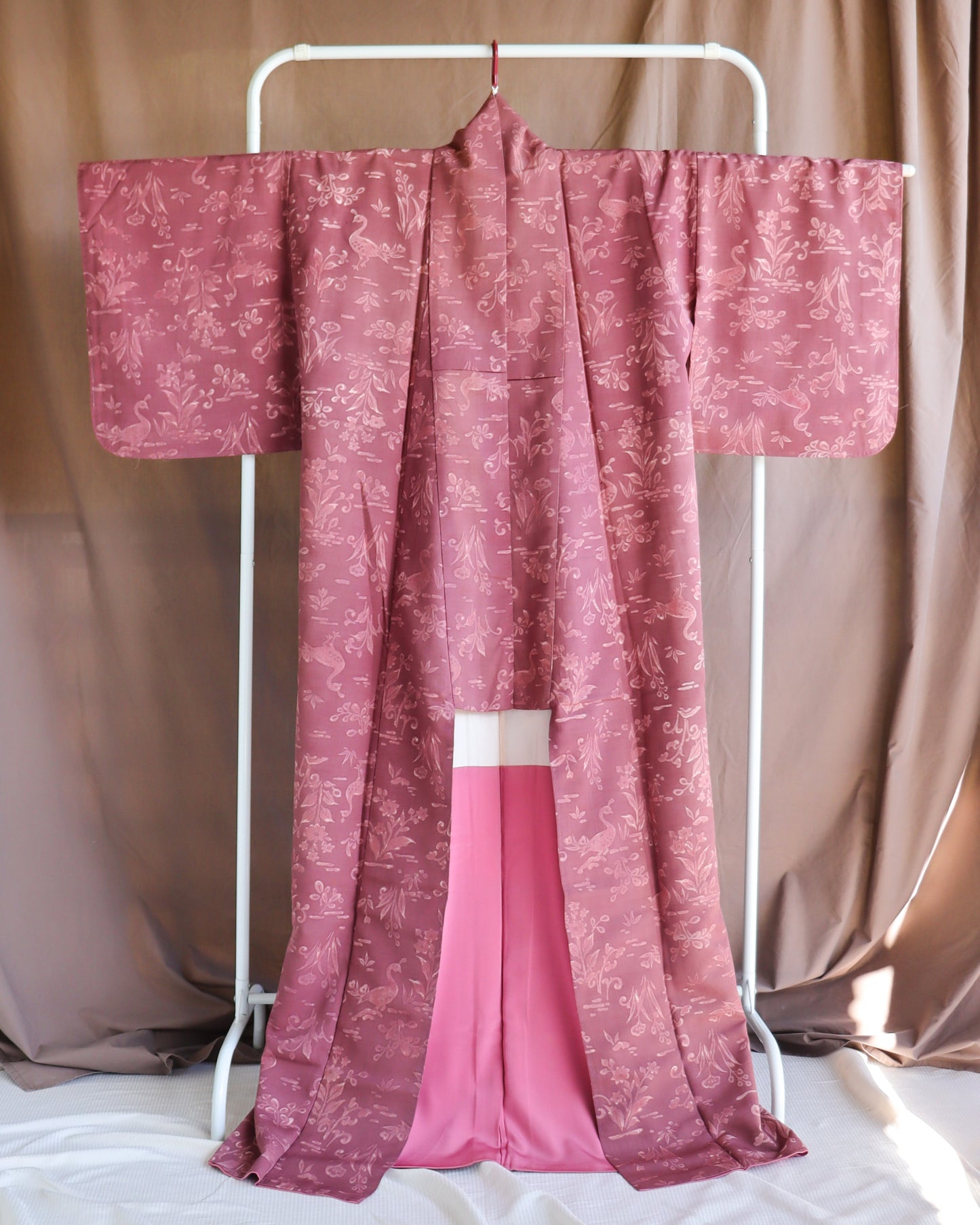 Vintage silk kimono in pink and purple. retro nature pattern.