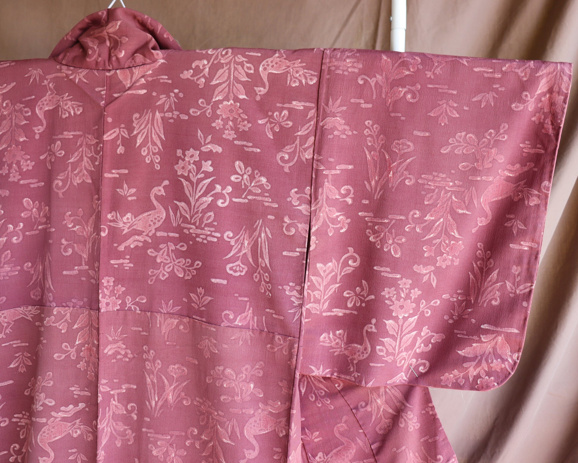 Vintage silk kimono in pink and purple. retro nature pattern.