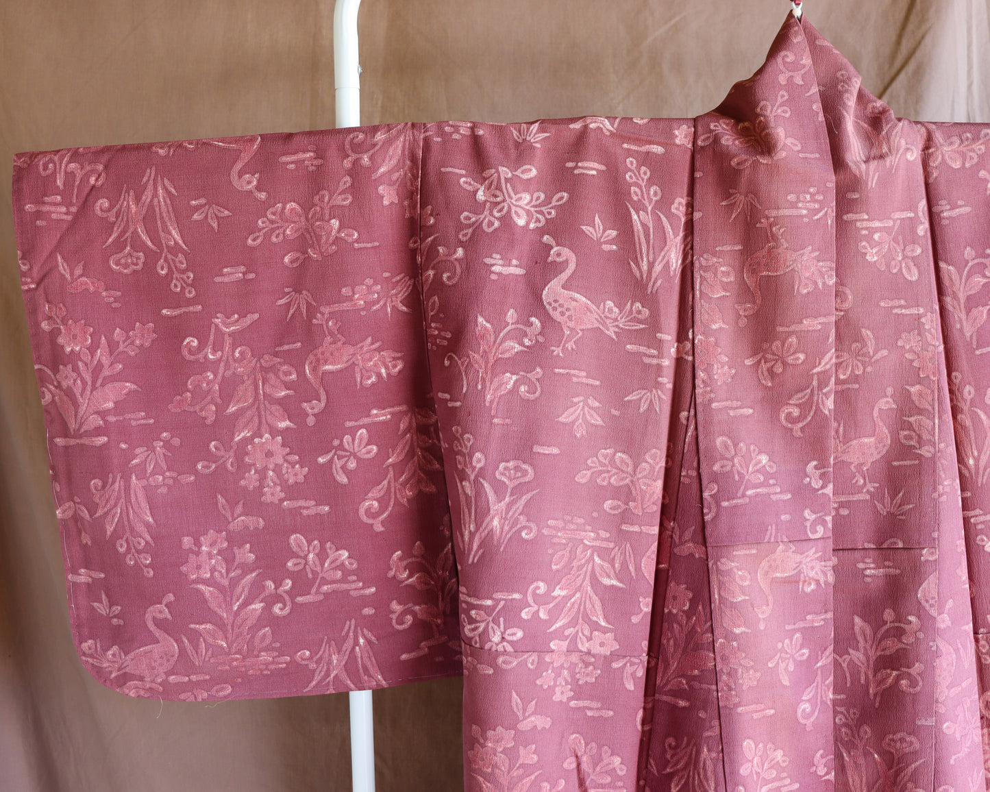 Vintage silk kimono in pink and purple. retro nature pattern.
