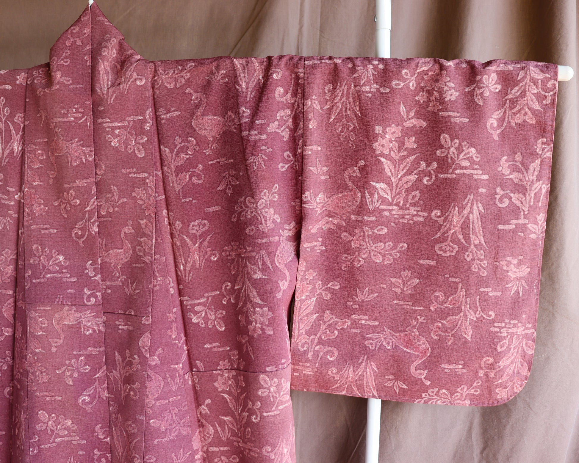 Vintage silk kimono in pink and purple. retro nature pattern.