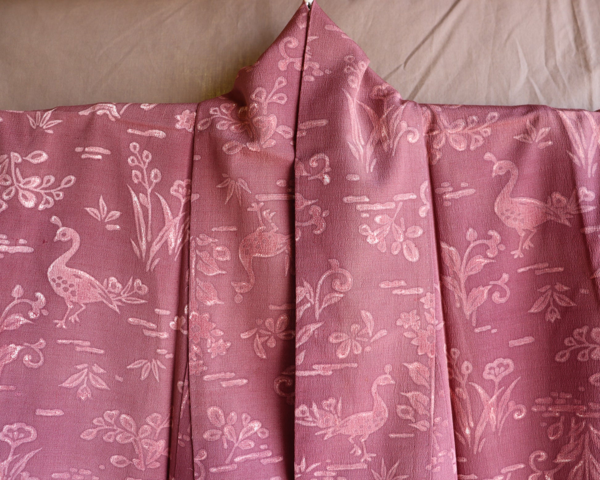 Vintage silk kimono in pink and purple. retro nature pattern.