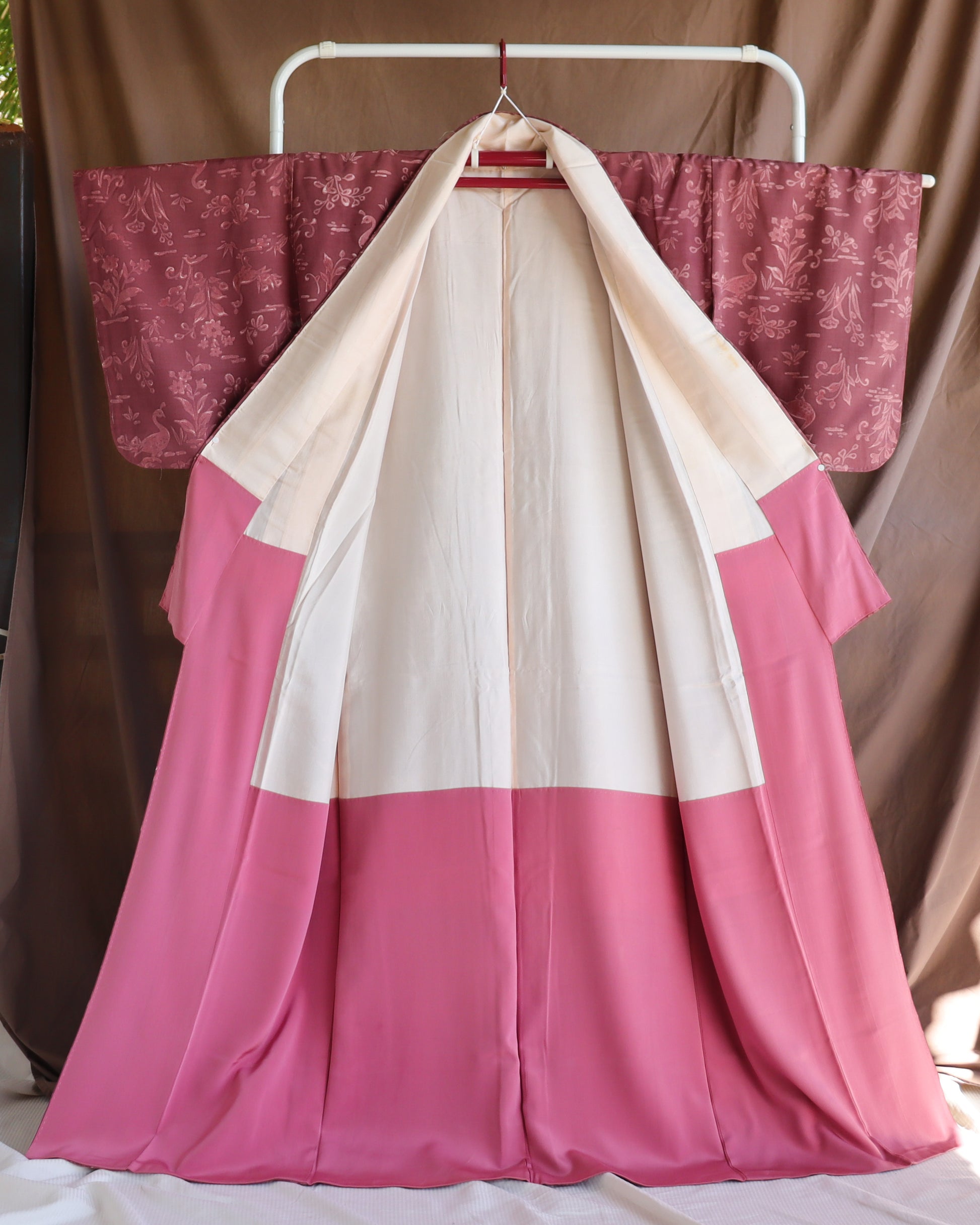 Vintage silk kimono in pink and purple. retro nature pattern.