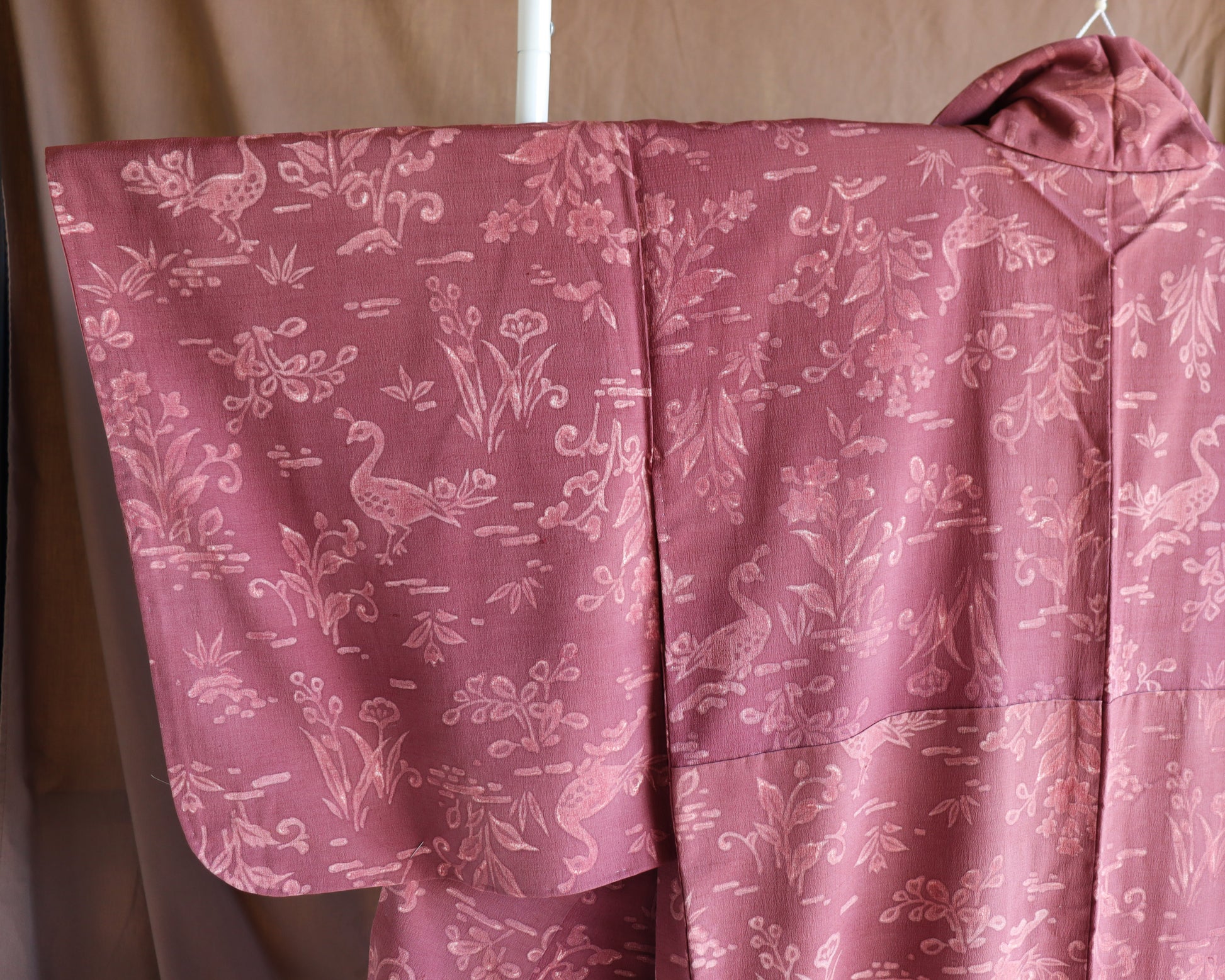 Vintage silk kimono in pink and purple. retro nature pattern.