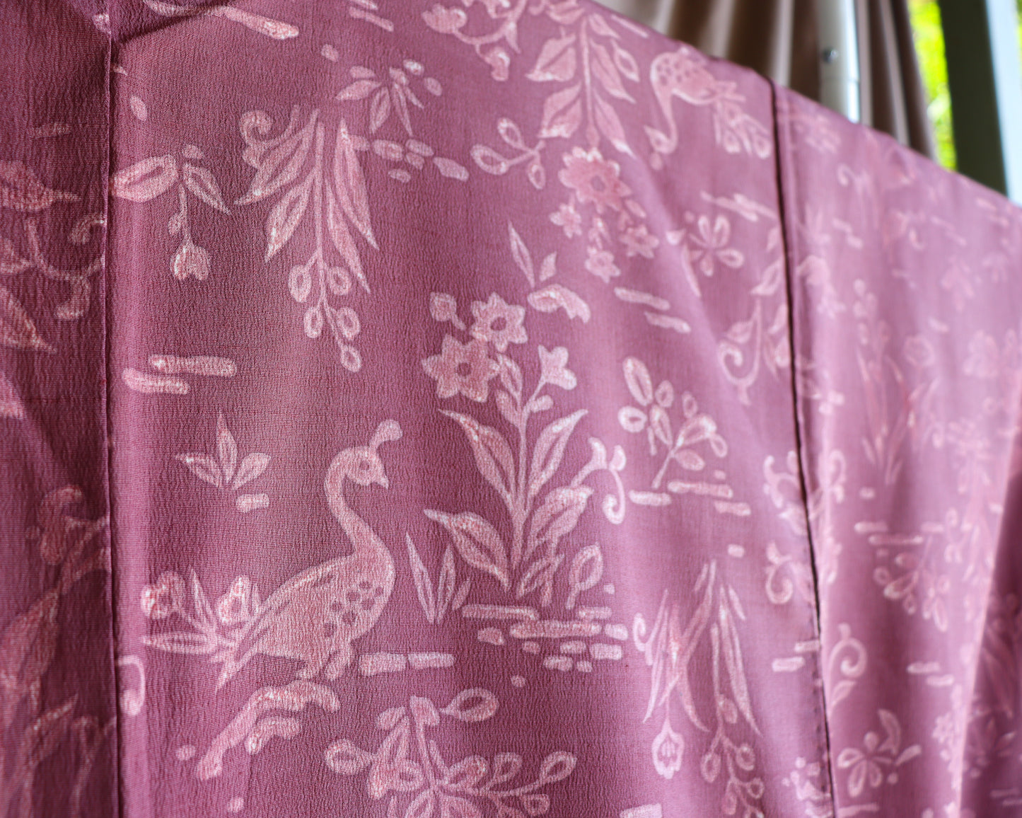 Vintage silk kimono in pink and purple. retro nature pattern.