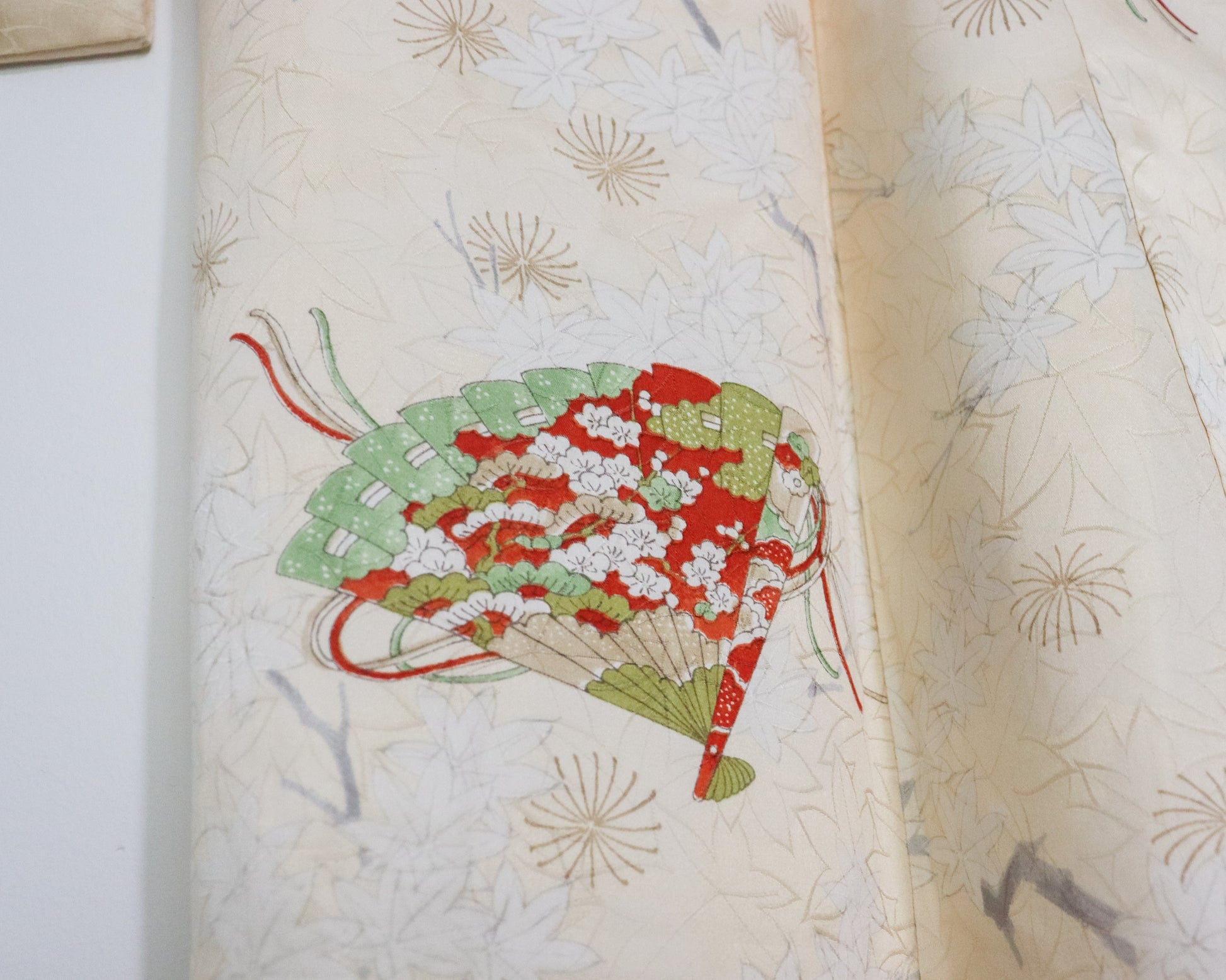 Vintage silk kimono in light yellow. pattern of momiji, flowers and Japanese traditional fan.