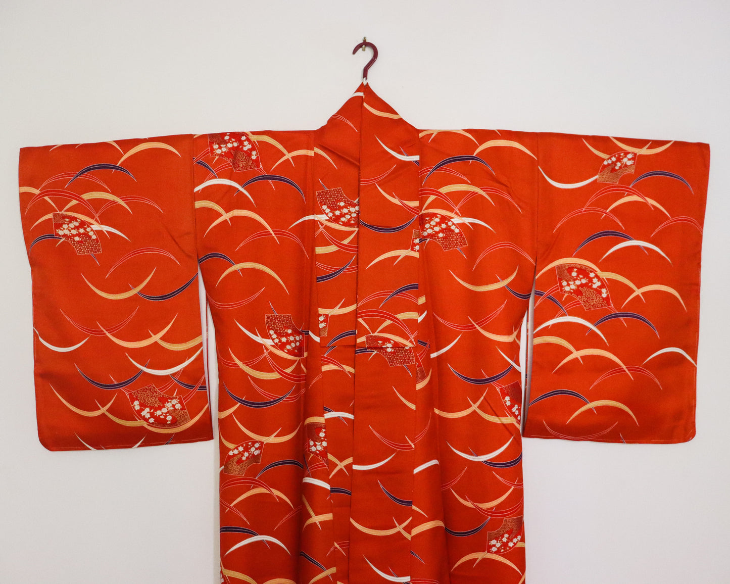 pre-loved kimono in vivid red with nature motif pattern and floral Japanese fans.