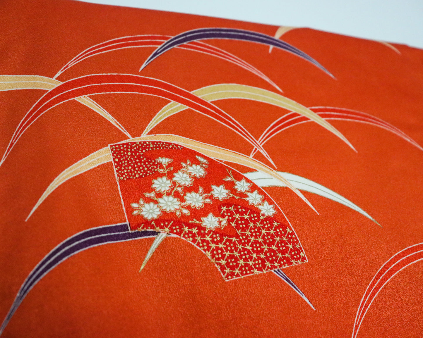 pre-loved kimono in vivid red with nature motif pattern and floral Japanese fans.