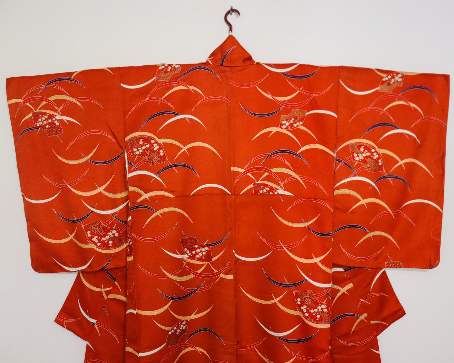 pre-loved kimono in vivid red with nature motif pattern and floral Japanese fans.