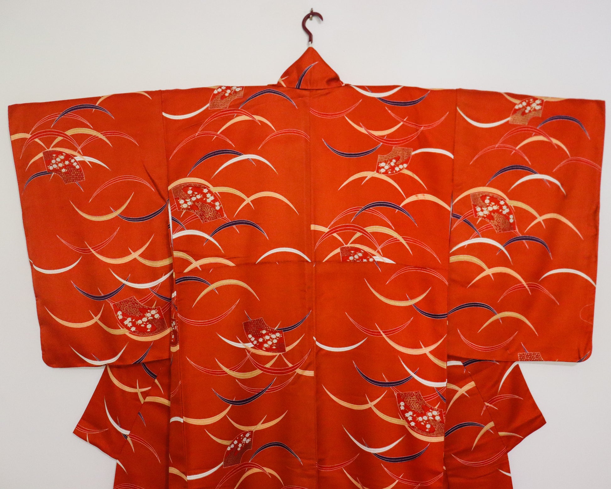 pre-loved kimono in vivid red with nature motif pattern and floral Japanese fans.
