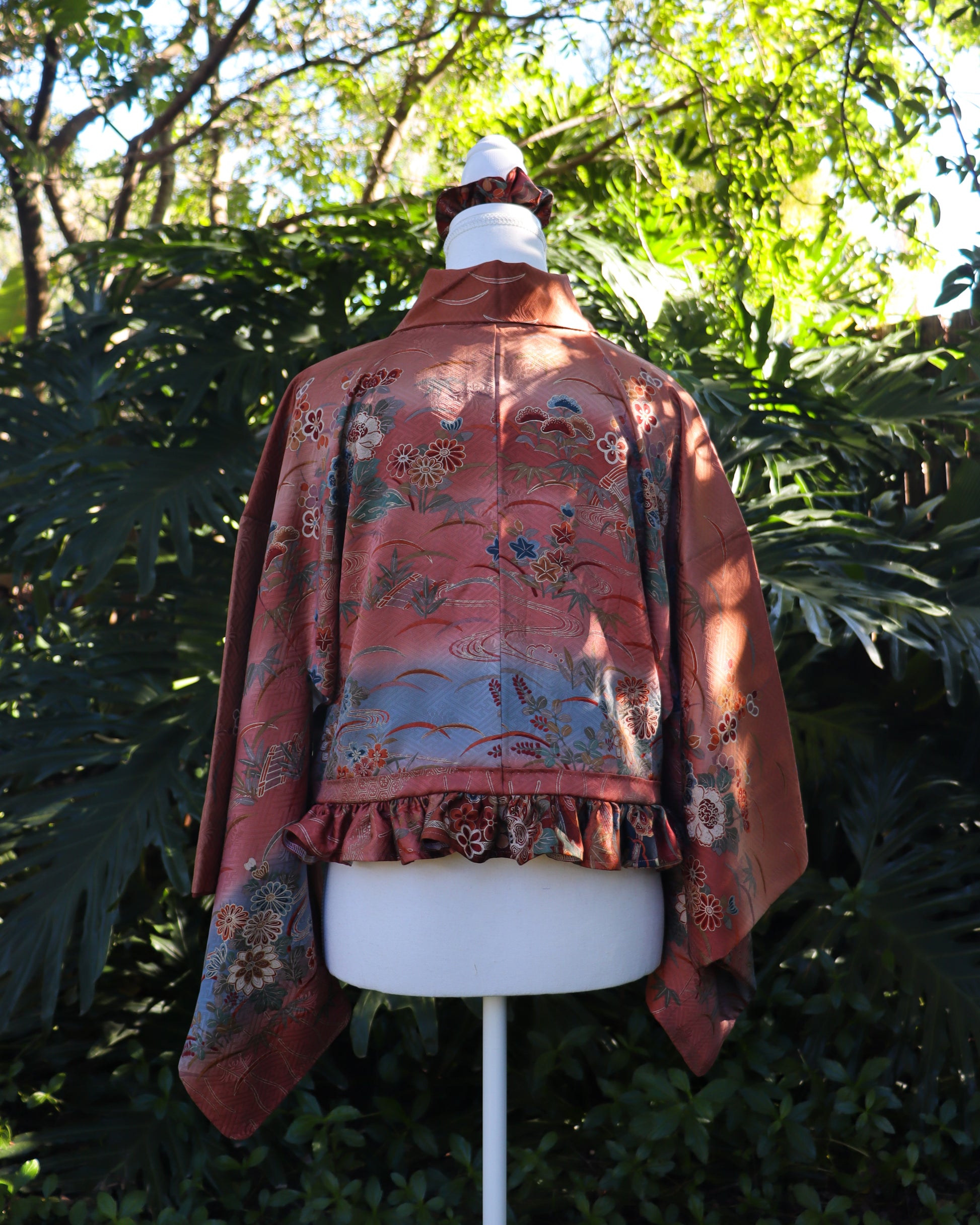Cropped kimono jacket made from a vintage kimono. The jacket features ruffled hem and frog closures, also comes with matching tote bag and scrunchie.