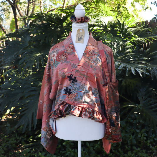 Cropped kimono jacket made from a vintage kimono. The jacket features ruffled hem and frog closures, also comes with matching tote bag and scrunchie.