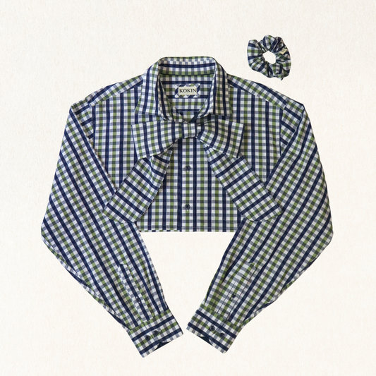 Green and blue checkered blouse with a matching scrunchie on a white background