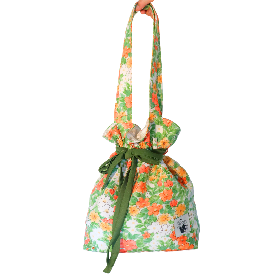 Drawstring tote bag made from silk kimono fabric. Vivid floral pattern. Shoulder straps.