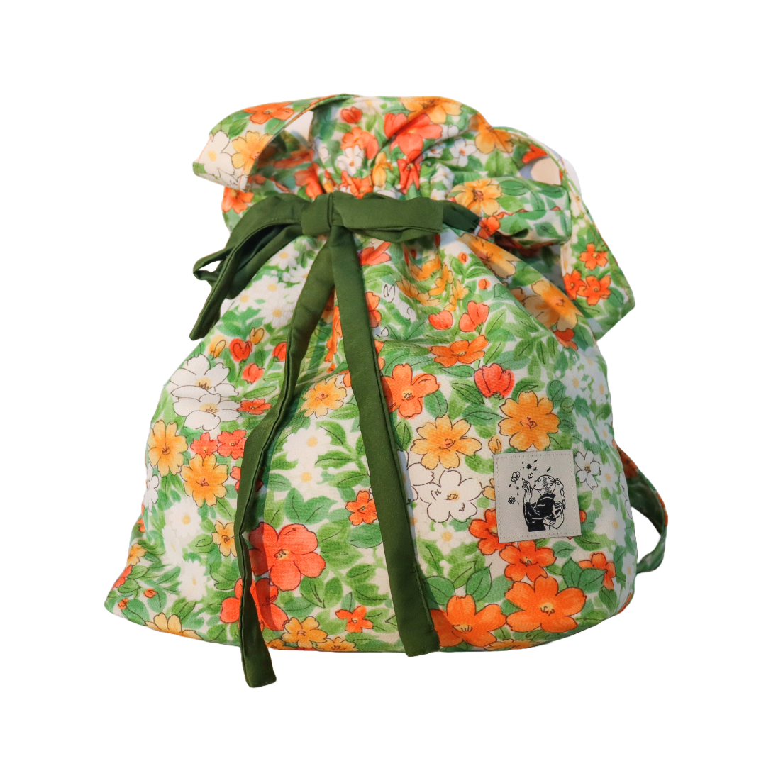 Drawstring tote bag made from silk kimono fabric. Vivid floral pattern.