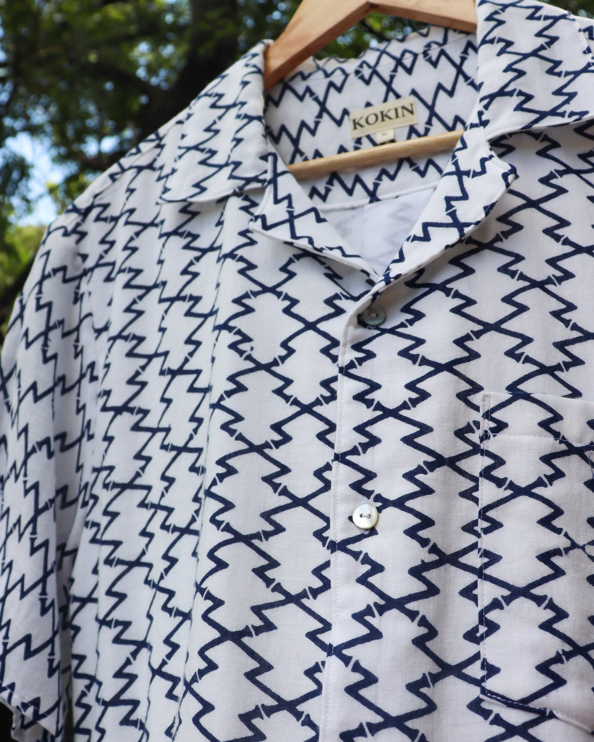Men's summer shirt made from summer kimono (yukata). The soft cotton gauze fabric is very comfortable. Close up photo of the shell buttons.
