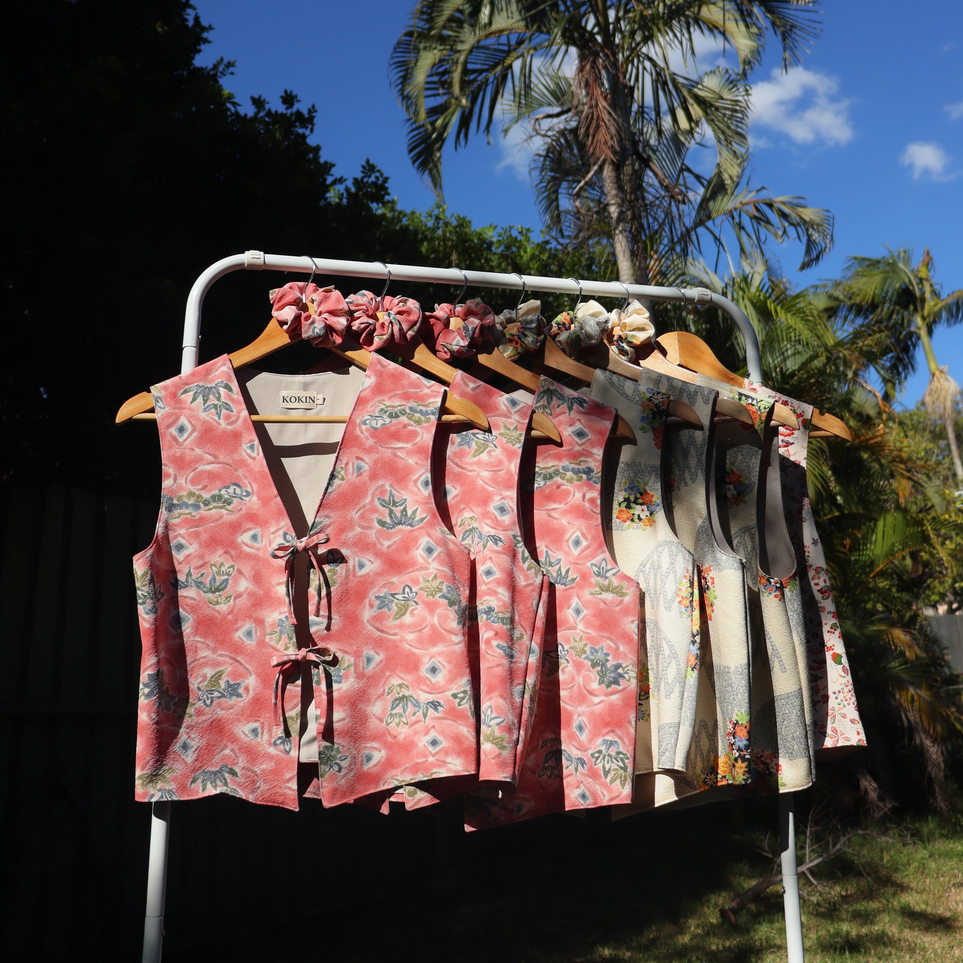 Women's front tie tops made from pre-loved silk kimono. Slow fashion. Upcycling. Fully lined with deadstock fabric. Aesthetic fashion photo in nature.