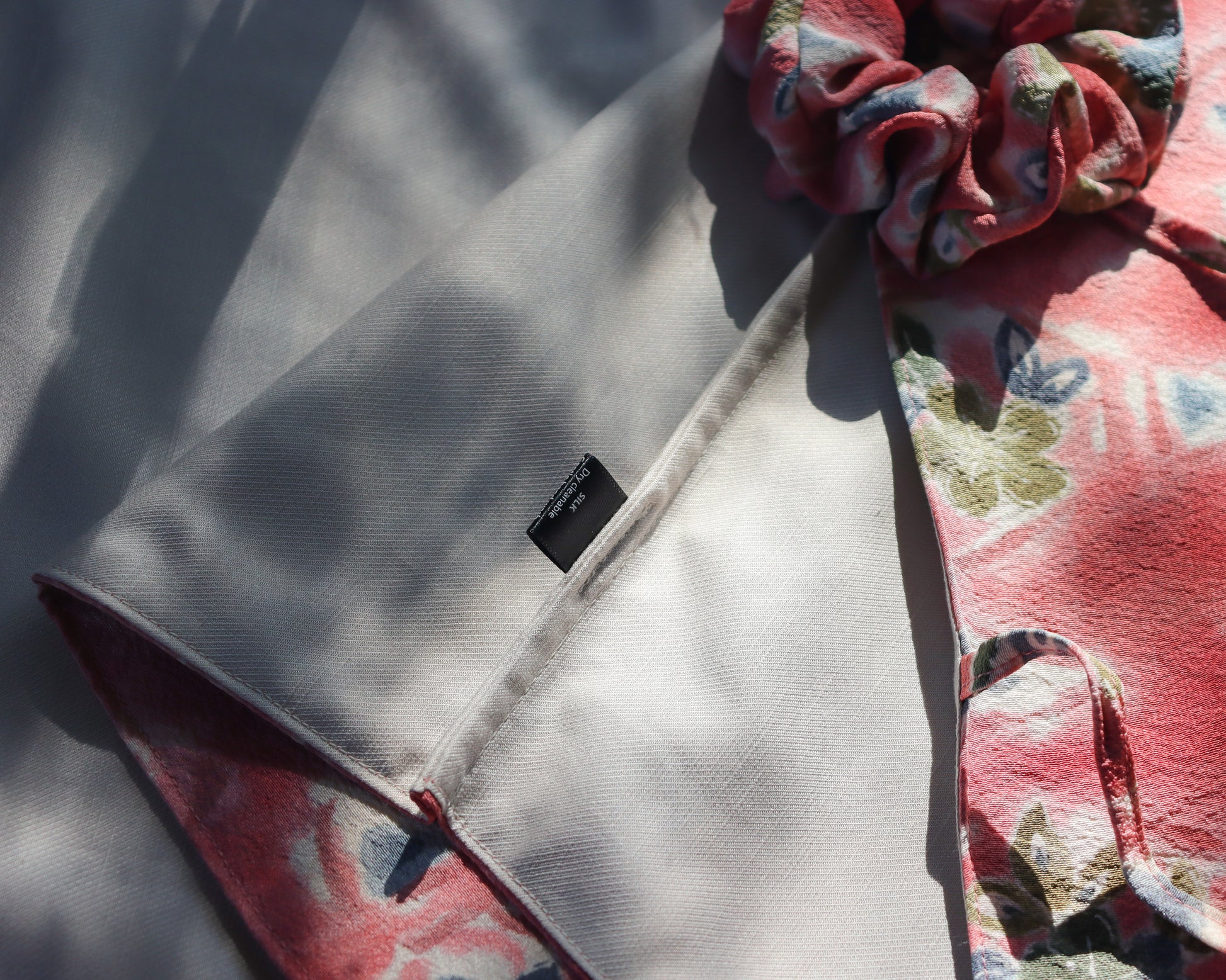 Women's front tie top made from pre-loved silk kimono. Slow fashion. Upcycling. Fully lined with deadstock fabric. Garment care tag.