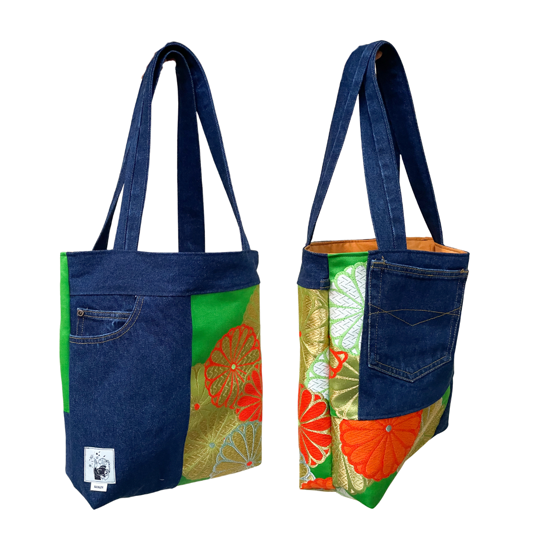 Tote bag with denim front and colorful back on a white background