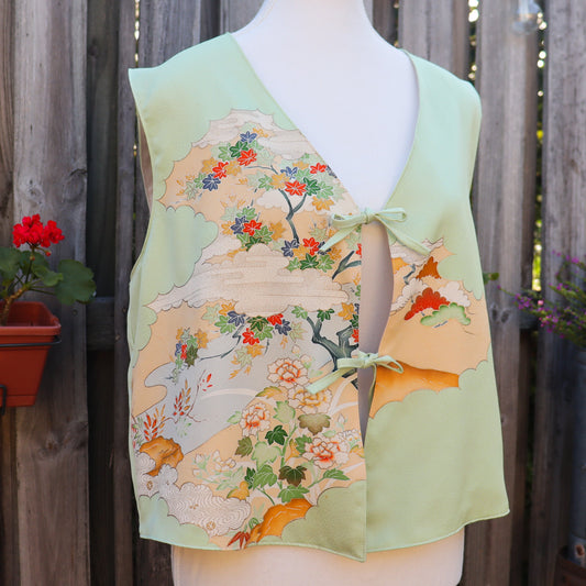 Mannequin wearing a floral-patterned top with a wooden fence background