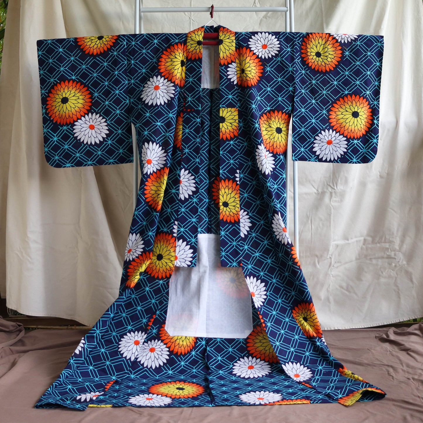pre-loved yukata. summer cotton kimono in navy with the pattern of flowers. vibrant floral print.