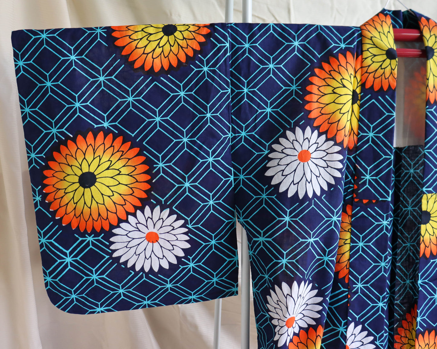 pre-loved yukata. summer cotton kimono in navy with the pattern of flowers. vibrant floral print.