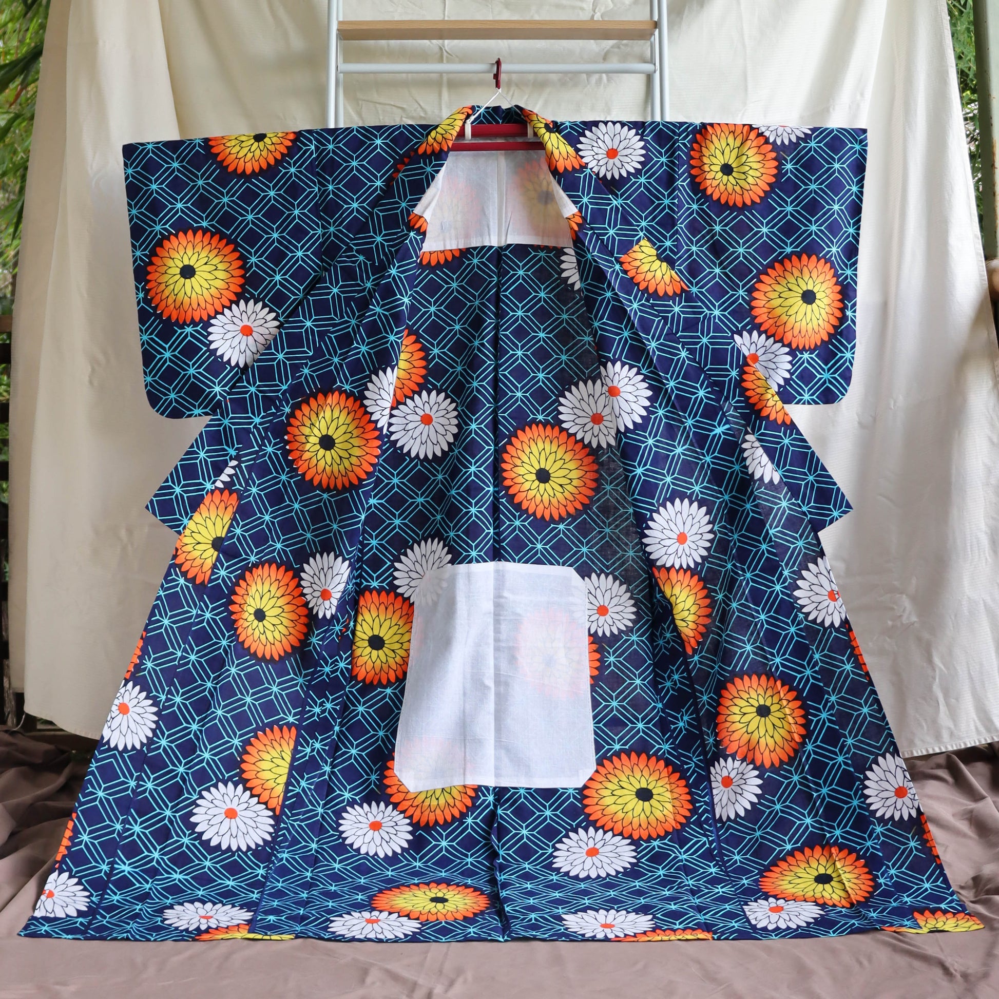 pre-loved yukata. summer cotton kimono in navy with the pattern of flowers. vibrant floral print.