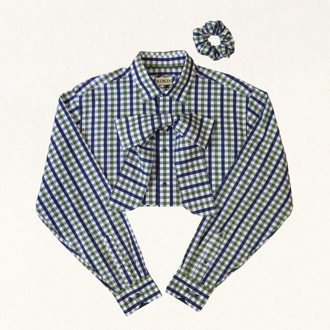 Green and blue checkered blouse with a bow and matching scrunchie on a white background