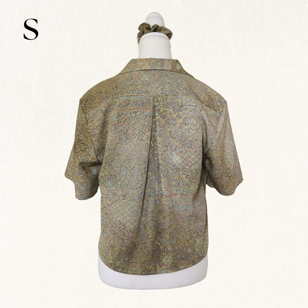 Short-sleeve patterned shirt on a mannequin with a white background