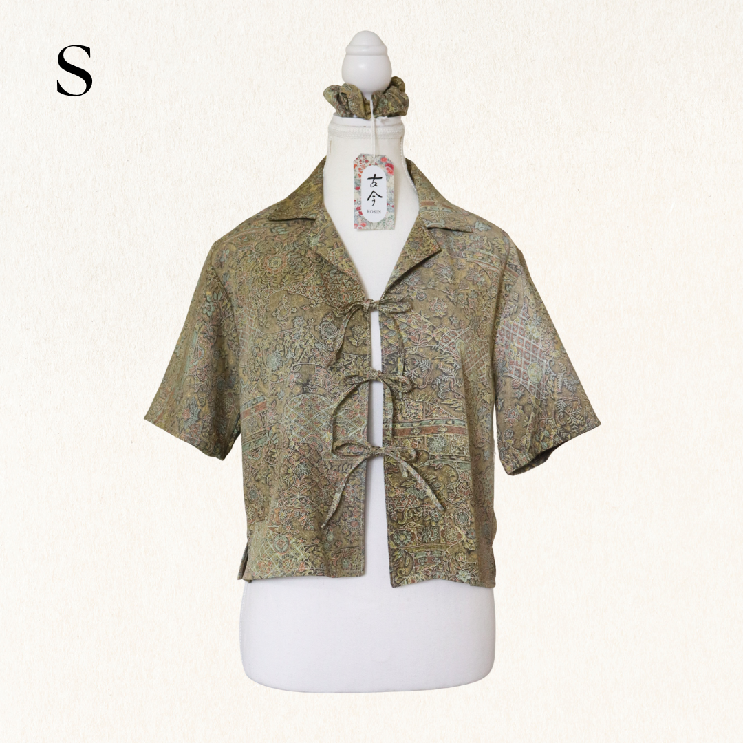 Short-sleeve patterned shirt on a mannequin with a white background