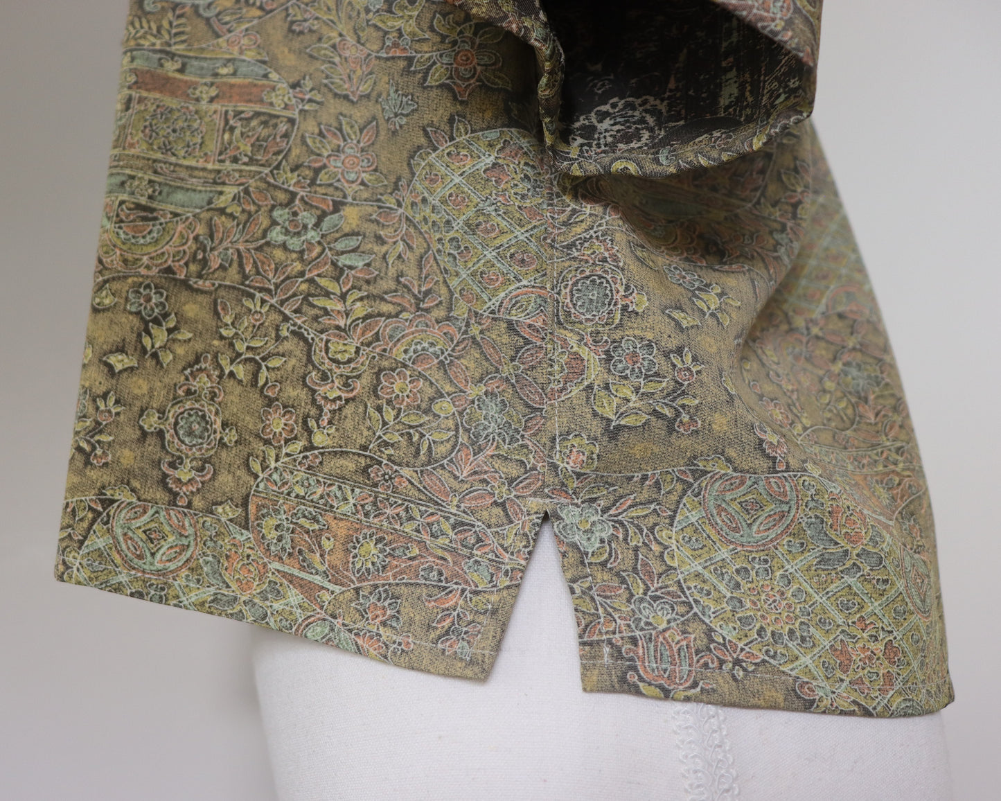 Patterned fabric on a mannequin with a plain background