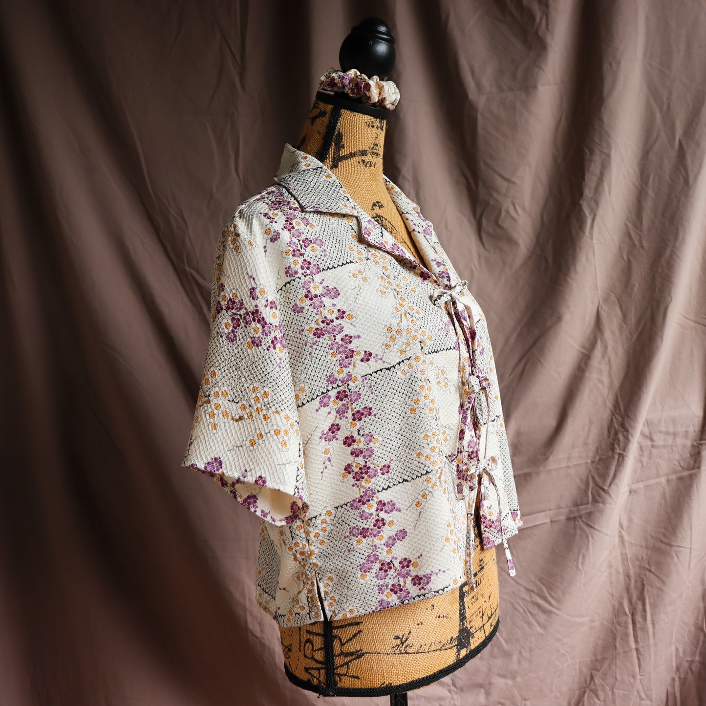 A silk shirt with front ties, made from secondhand kimono.