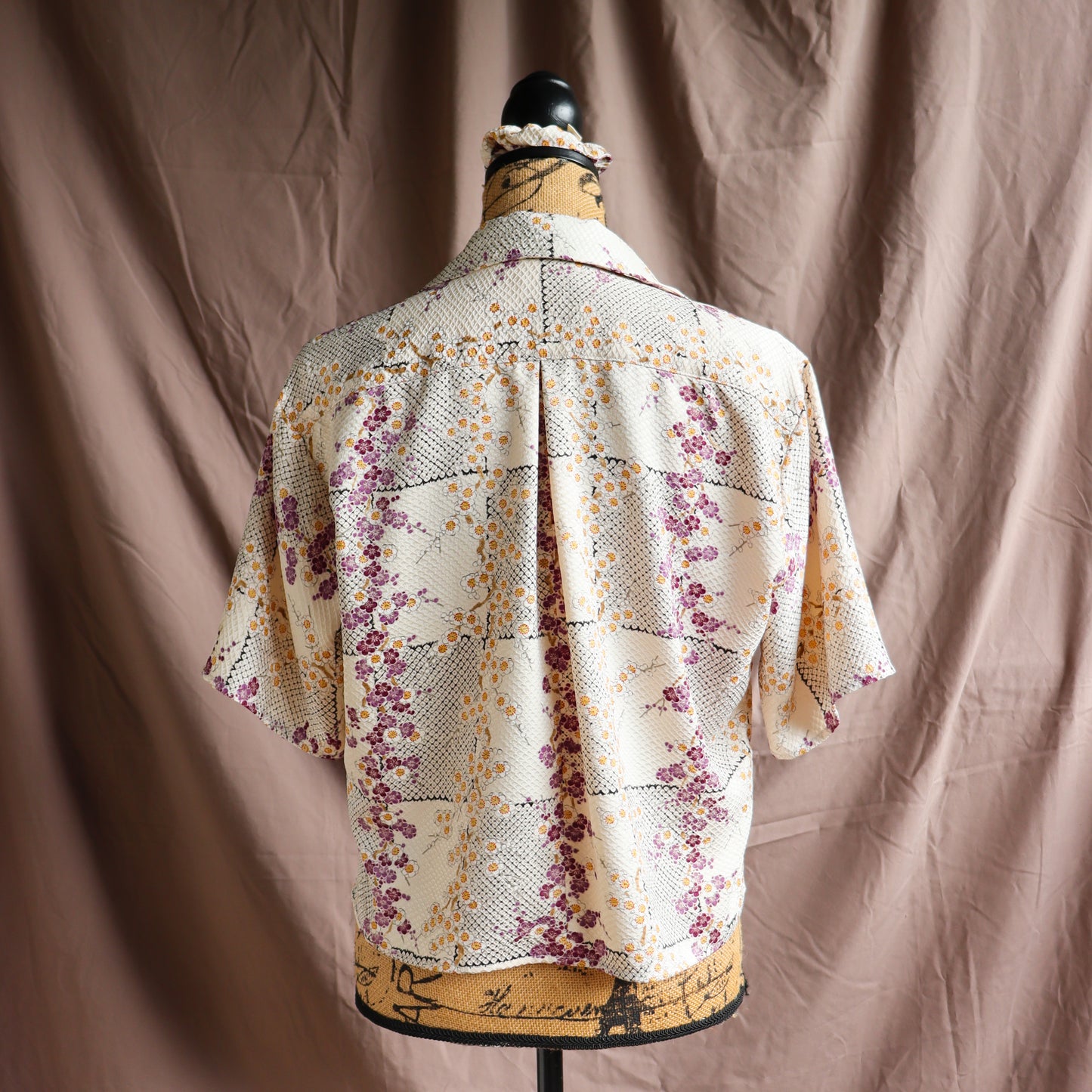 A silk shirt with front ties, made from secondhand kimono.