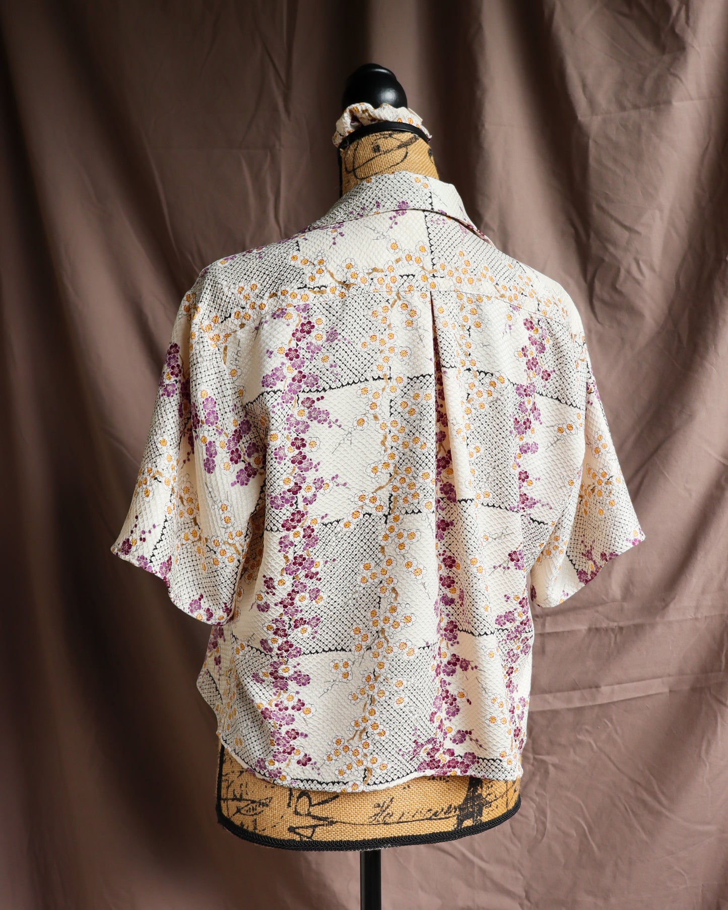 A silk shirt with front ties, made from secondhand kimono.