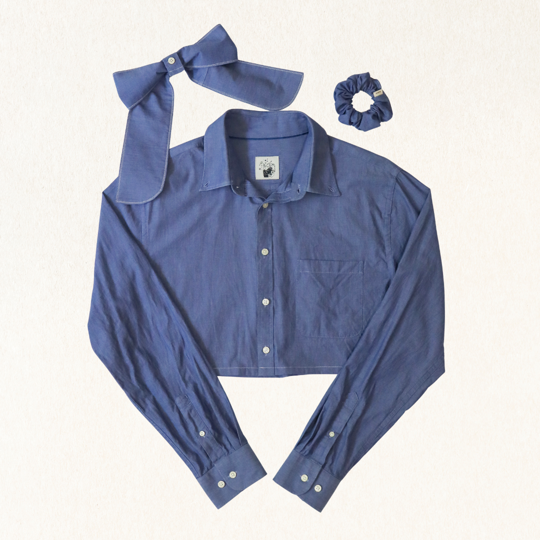 Blue shirt with matching bow and scrunchie on a white background
