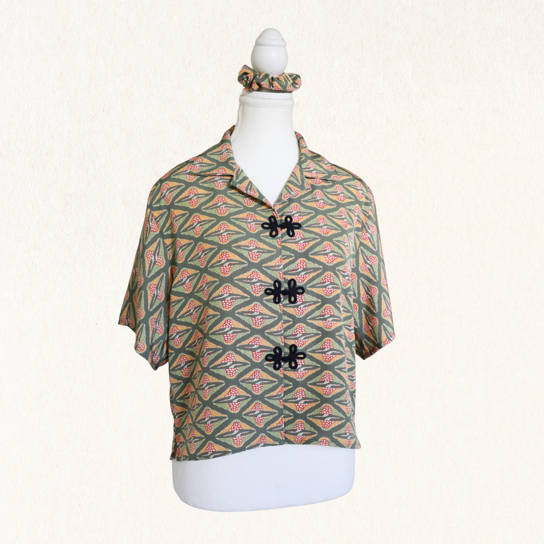 Patterned shirt on a mannequin with a white background