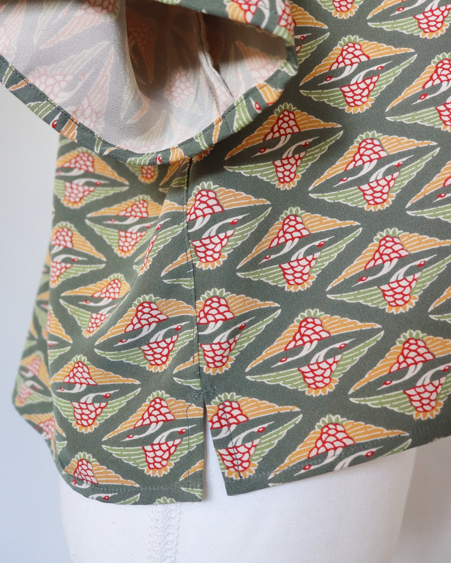 Patterned fabric on a mannequin with a white background