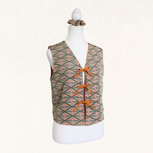 Patterned vest on a mannequin with a white background