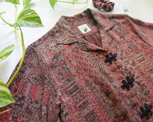 Patterned shirt with floral details on a white background